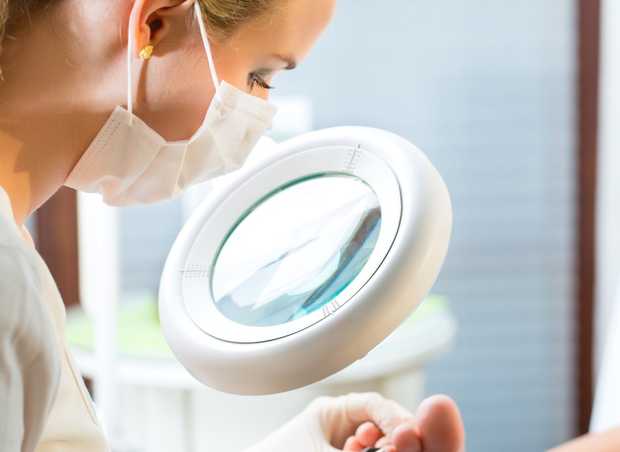 Woman receiving podiatry treatment in a Day Spa